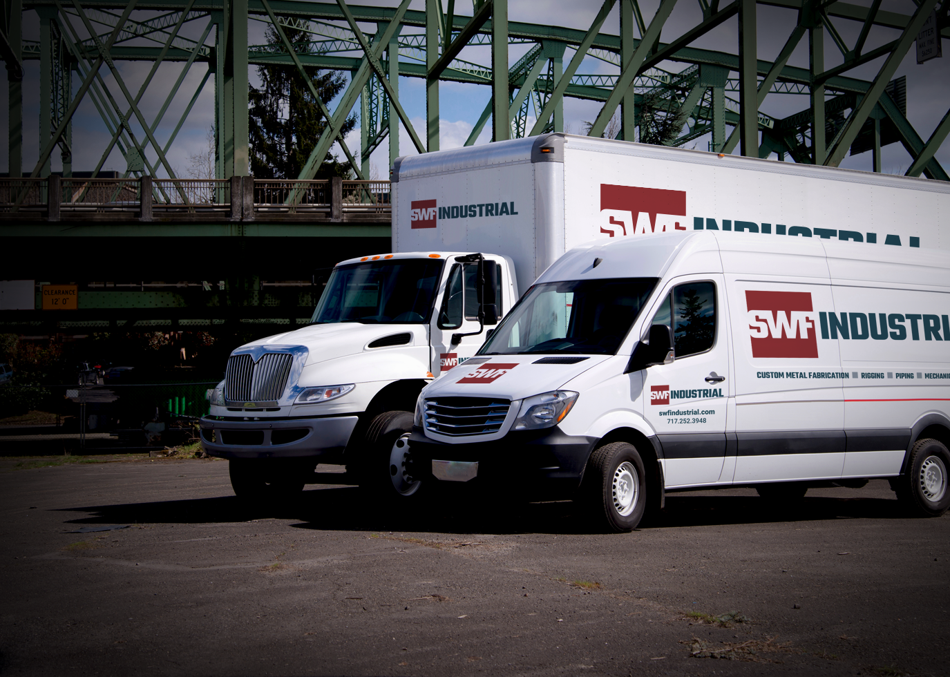 SWF Truck sides designed by Synapse Marketing on two white trucks